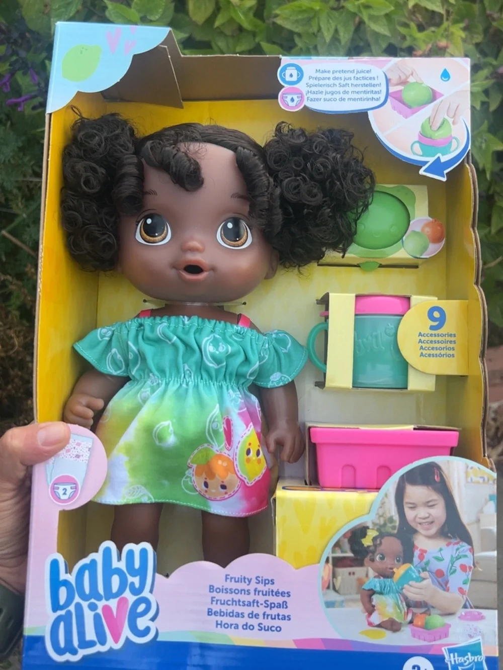 Hasbro Baby Alive Brown Doll in Green Fruit Dress with Pink Accessories